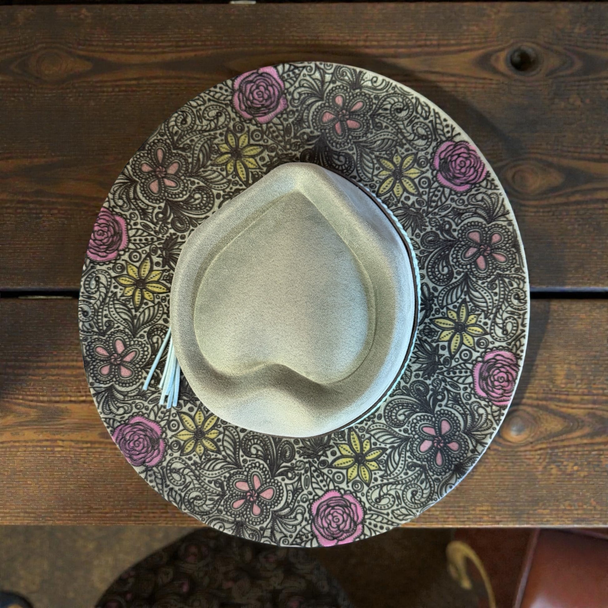 Wide brim vegan suede hat with laser burned floral design and blush pink flower accents