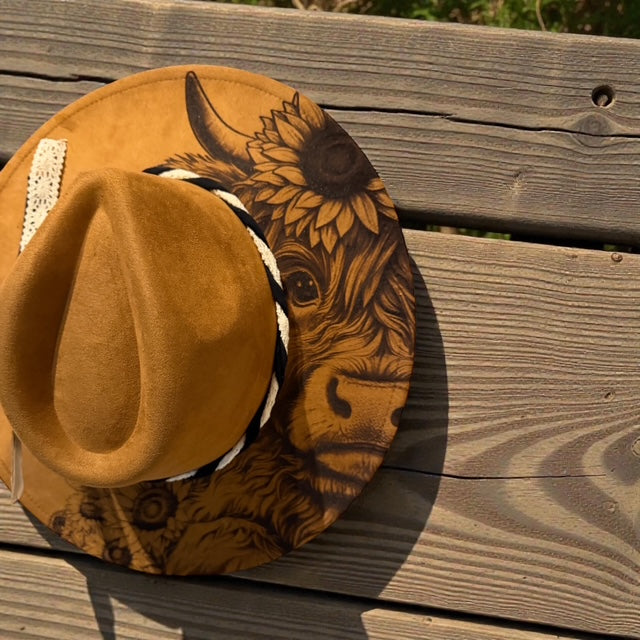 Boho wide brim vegan suede hat with laser engraved highland cow and sunflower design.
